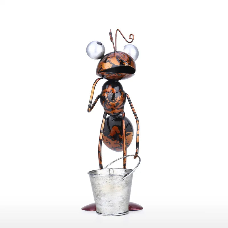 Hand-worked iron ant garden sculpture with galvanised bucket planter, distressed amber and black fired finish, 13 inches tall, white background