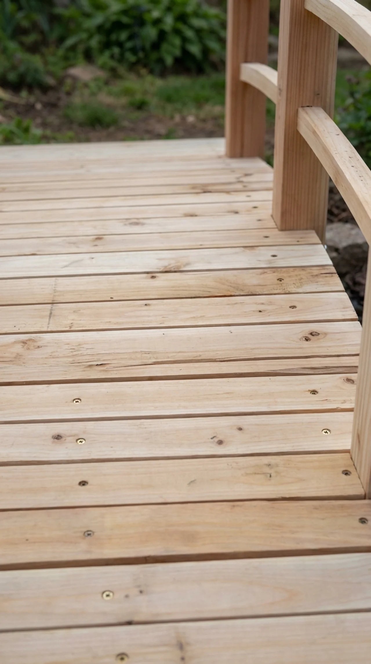 Close-up of slatted fir deck boards and curved timber