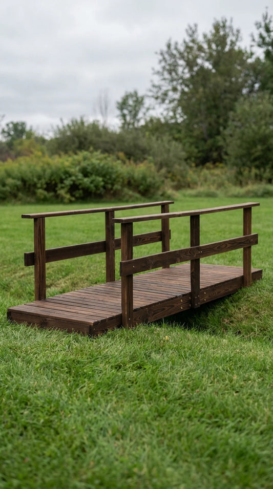 7ft stained pine garden bridge with double railings, Still Water and Stone collection, garden setting

