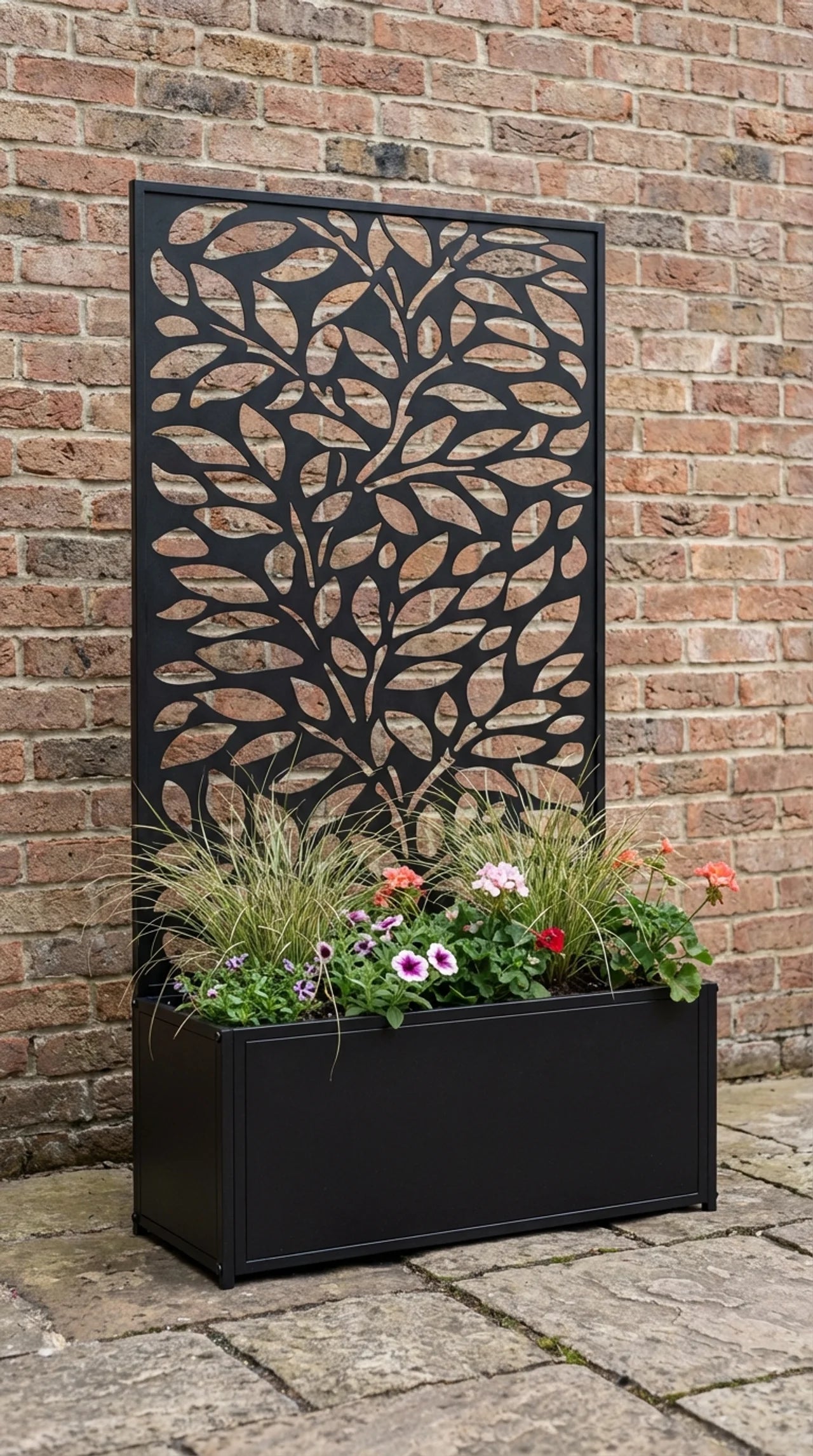 Metal leaf screen garden planter freestanding on patio, black powder coated finish, Form and Foliage collection

