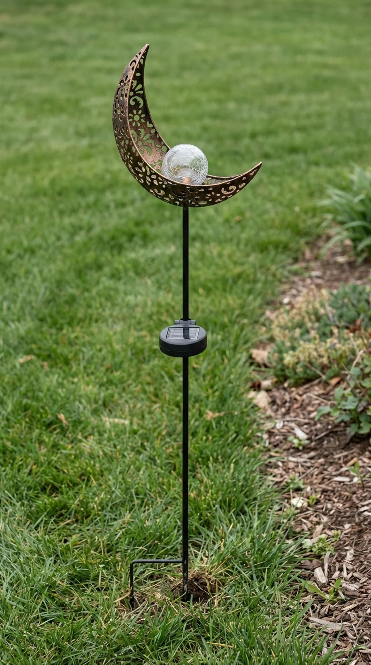 Filigree cut iron crescent moon solar garden stake light with crackle glass globe, 30.7 inches tall, day garden setting